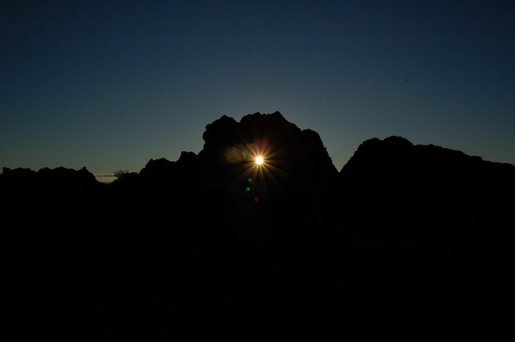 Sunlight shining through a tiny aperture leading the way to change